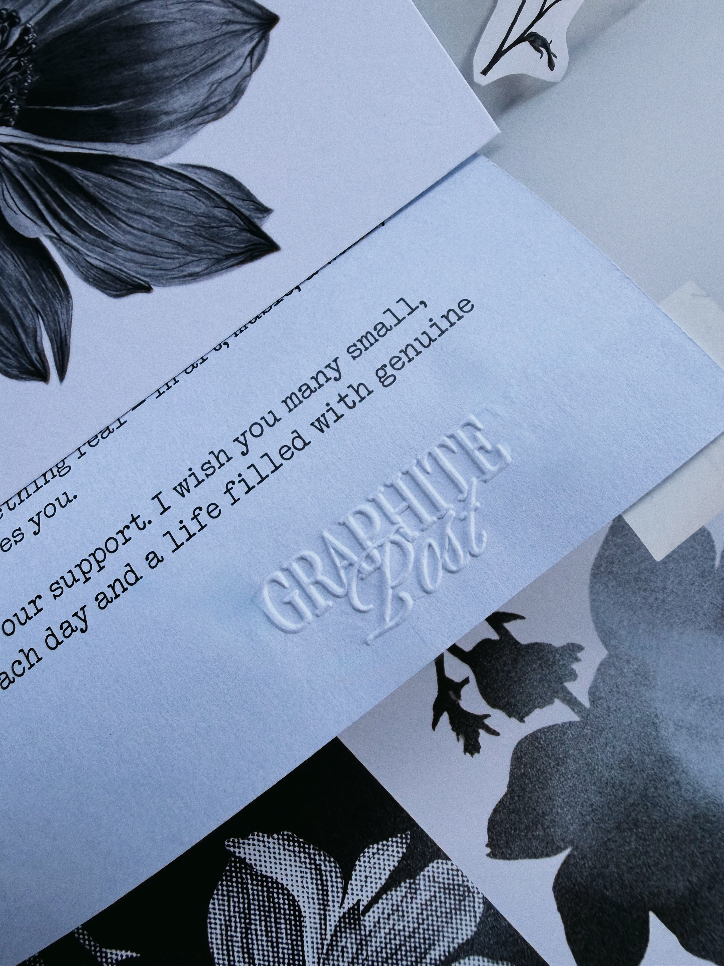 Graphite Post embossed letter and envelope closeup