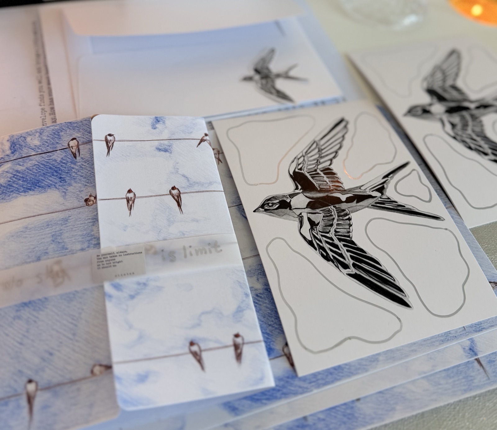 Graphite Post swallow collection — close-up of swallow stickers and wire-and-birds card